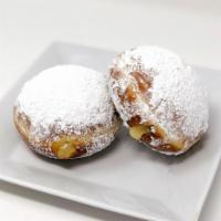 Lemon Paczki · A Lemon filled donut covered in powdered sugar. The tartness of the lemon paired with the sw...