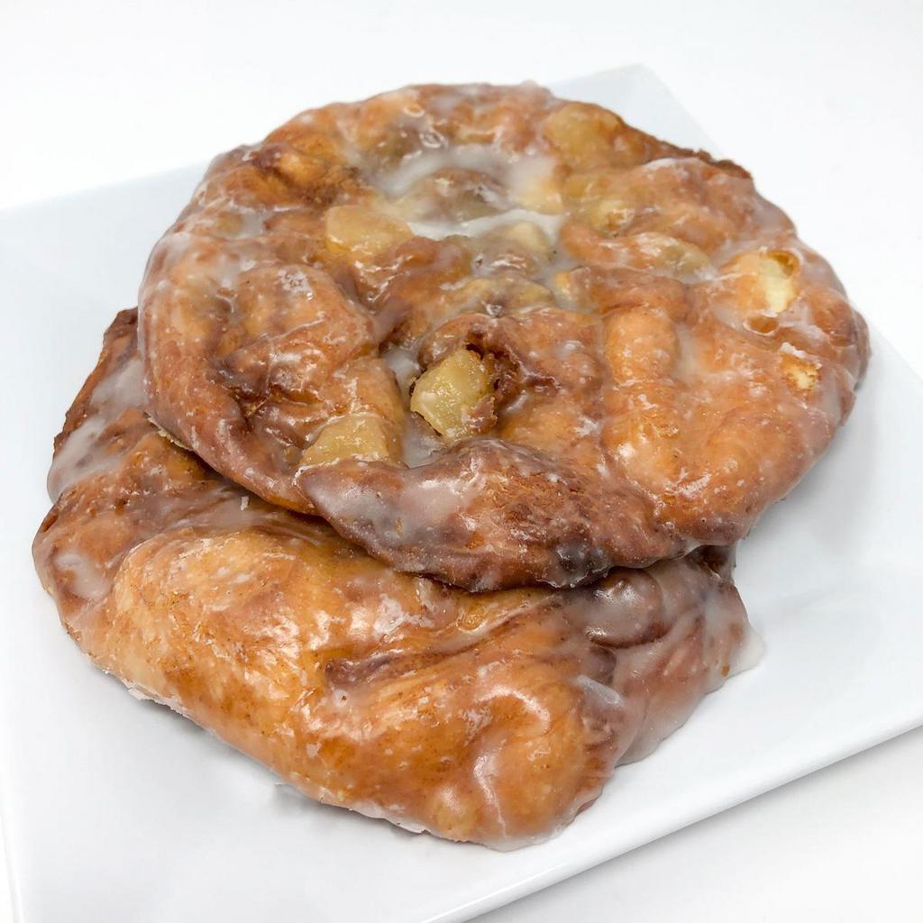 Apple Fritter · A thin crispy cinnamon dough with chunks of apples and a glaze icing. Fried to perfection and great with a cup of coffee!