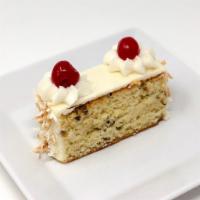 Italian Creme Cake Slice · Buttermilk cake made with pecans and coconut and iced in cream cheese.