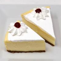 Cheesecake Slice - New York · Traditional New York style cheesecake topped with whipped cream.