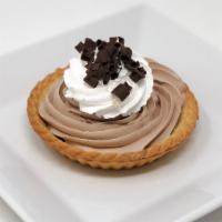 Chocolate Mousse Tart · A small pie shell filled with chocolate mousse and topped with whipped cream.