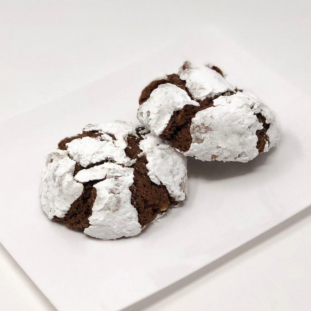 Chocolate Krinkle Cookie · A chocolate brownie-like cookie with pecans and then rolled in powdered sugar. Simply delightful!