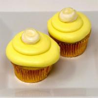 Lemon Drop Cupcake · Lemon cupcake topped with lemon icing, a dollop of buttercream and a swirl of lemon filling!