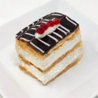 Napoleon Treat · Stacks of flakey puff pastry layered between French pastry cream and topped with chocolate g...