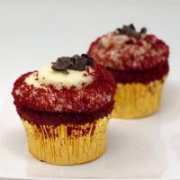 Southern Red Velvet Cupcake · Our southern red velvet cake with cream cheese icing, topped with decadent chocolate curls! 