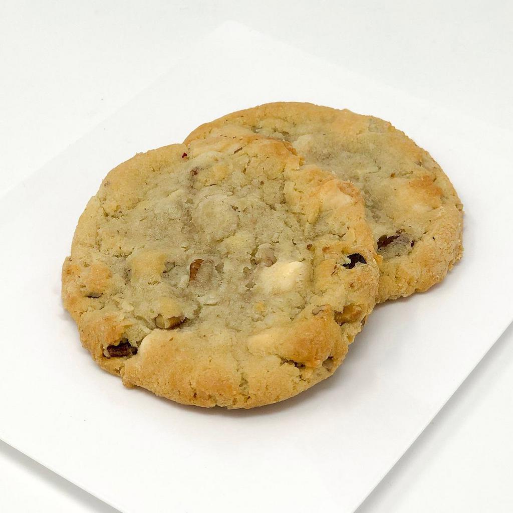White Chocolate Chip Cookie · White chocolate chips, coconut, and pecans all wrapped up in one cookie! The flavor combination is out of this world, you must try them!