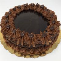 Chocolate Cheesecake · Rich chocolate-flavored New York style cheesecake with ganache on top. Have us put some cher...