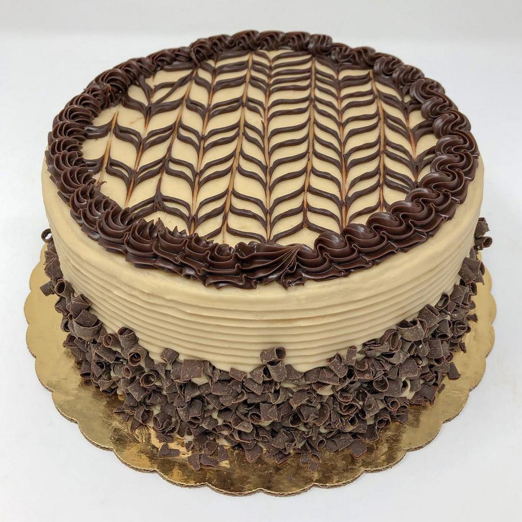 Caramellatte Dessert Cake · Coffee lover? Try this...Mocha cake with caramel filling and our mocha buttercream icing and miniature chocolate curls pressed on the sides, also available in a 6