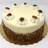 Carrot Dessert Cake · 2 layers of our carrot cake made with pecans and pineapple filled with vanilla cream and ice...