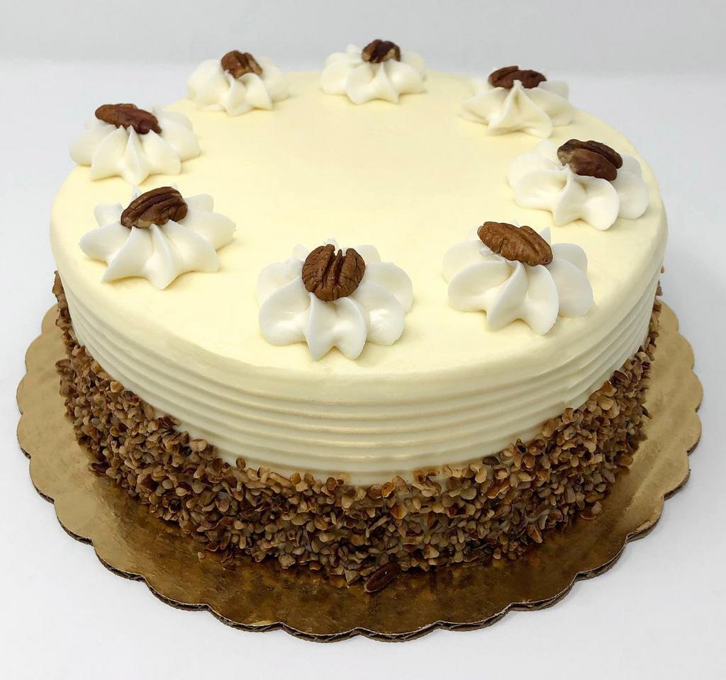Carrot Dessert Cake · 2 layers of our carrot cake made with pecans and pineapple filled with vanilla cream and iced in cream cheese.