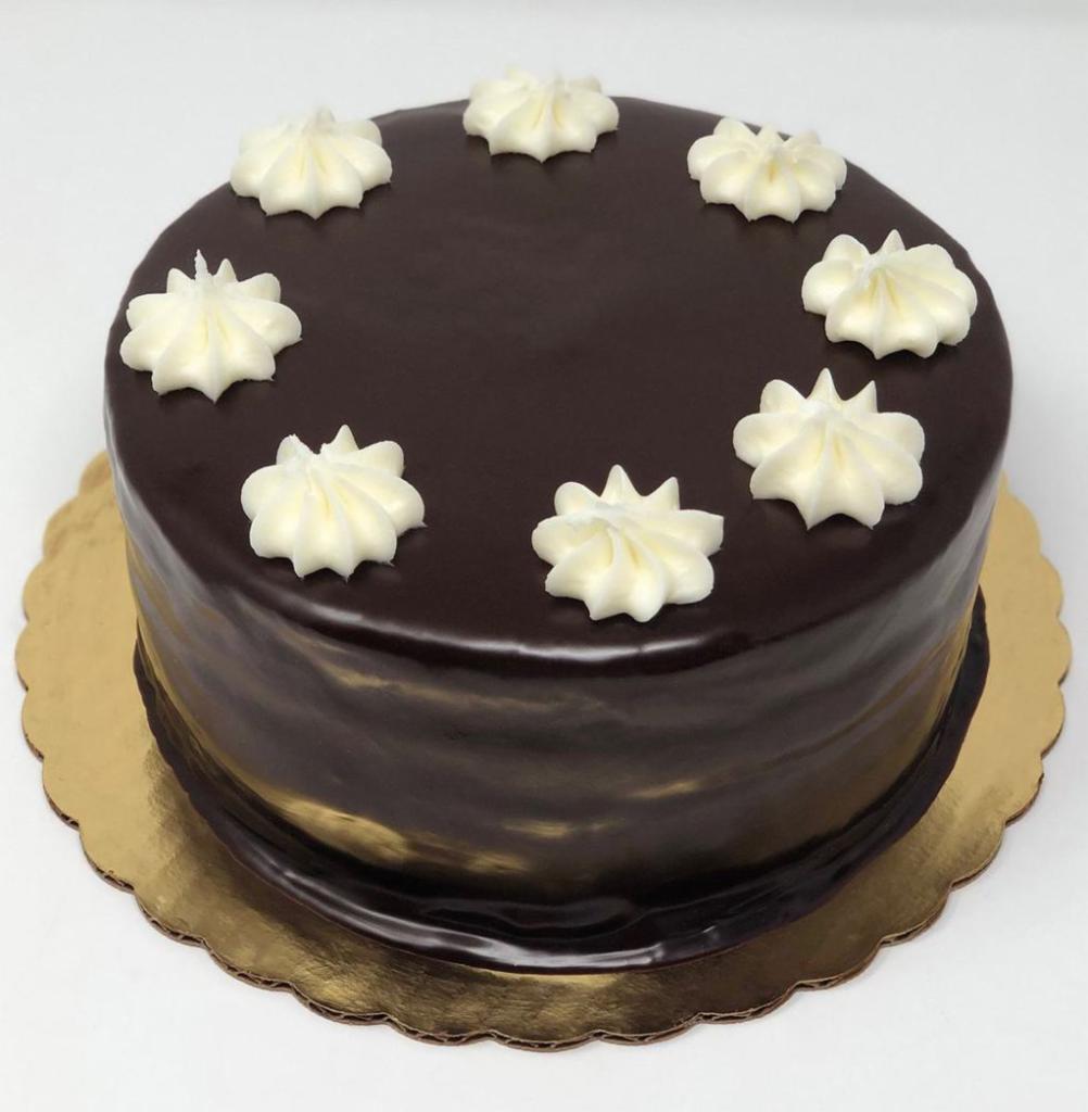 Snowflake Cake · One of our most popular dessert cakes, some people may call it the ding dong cake! 2 layers of chocolate cake with whipped cream filling and chocolate ganache icing.