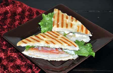 Grilled Chicken Sandwich · Grilled chicken breast, provolone cheese, lettuce, tomato, red onion with ranch dressing on focaccia.
