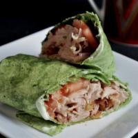 Turkey Club Wrap · Turkey and bacon with lettuce, tomato and red onion with ranch dressing in a tortilla wrap.