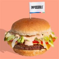 THE SHOP BURGER · Our classic Shop Burger with perfectly seared 1/4 lb. Impossible™ Burger patty stacked with ...