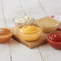 Dipping Sauce- 8 Oz Bowl · Pick from our popular Cheddar cheese sauce or for a hint of spice go for Nacho cheese.  Serv...