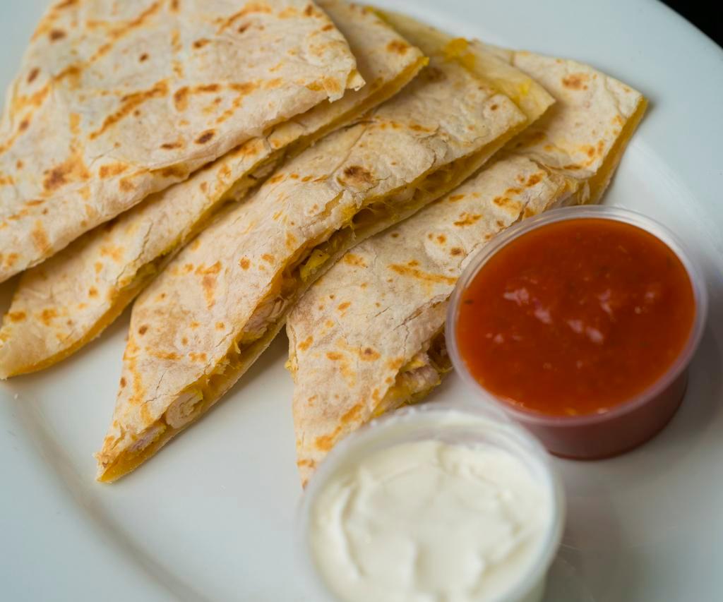 Chicken Quesadilla · Grilled flour tortilla with grilled chicken and cheese served with sour cream.