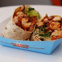 Crispy Buffalo Chicken Wrap · Our all natural chicken breast fried in our famous breaded recipe, tossed in Buffalo sauce, ...