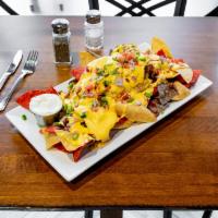 Nachos Supreme · Pico De Gallo, Cheddar, sour cream, jalapenos