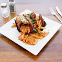 Penne Vodka Tacos · Fried Chicken, homemade vodka sauce, mozzerella, pecorino, penne