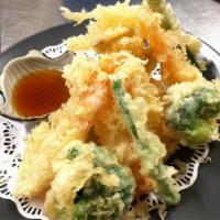 Vegetable Only Tempura Appetizer (12 pc) · 12 pieces Lightly battered and fried carrot, yam, onion, broccoli, and shrimp. Served with o...