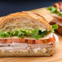 Turkey and Cheese Croissant Sandwich · Served on a flaky French pastry. 