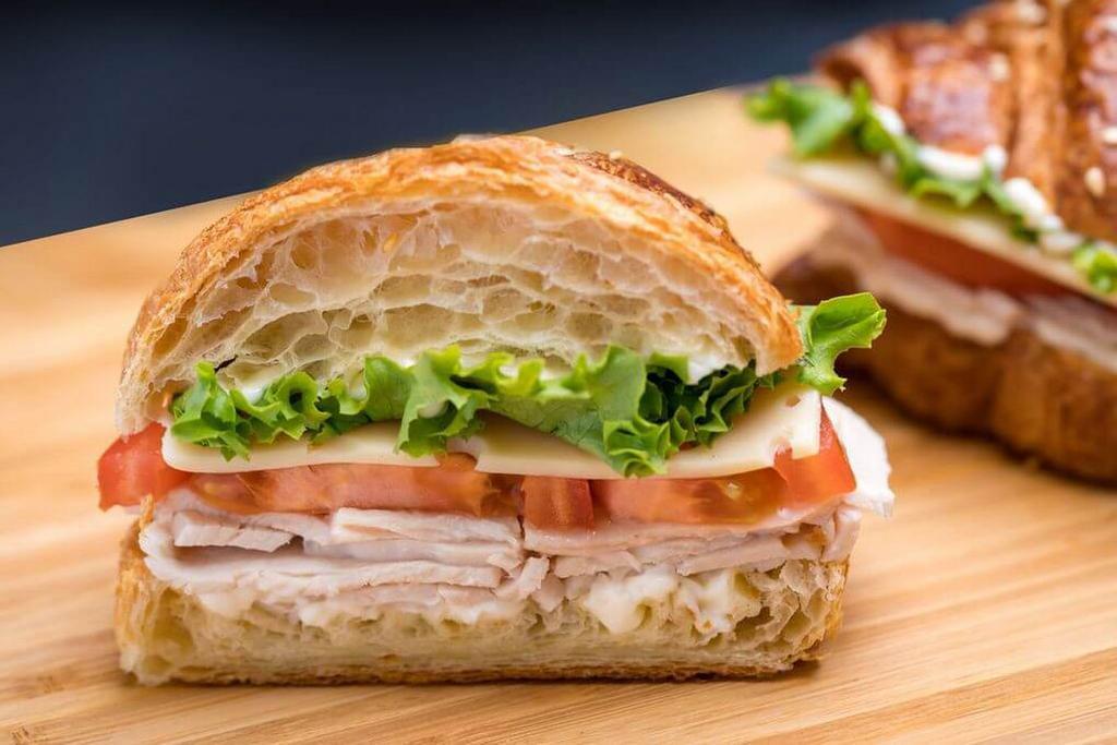 Turkey and Cheese Croissant Sandwich · Served on a flaky French pastry. 