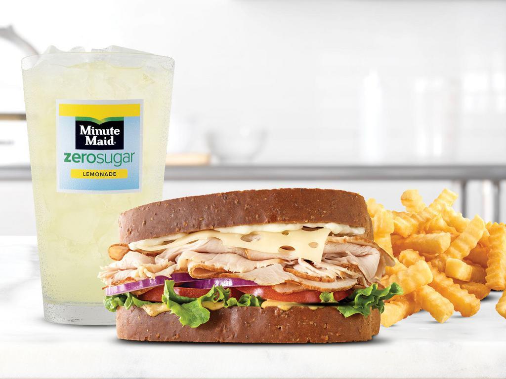 Roast Turkey & Swiss Sandwich Small Meal · Oven-roasted turkey, ripe tomatoes, lettuce, thinly sliced red onions, Swiss Cheese, mayo and spicy brown honey mustard. Together they make the Roast Turkey & Swiss sandwich, the sandwich roast turkey was made to go on. Served with a drink.