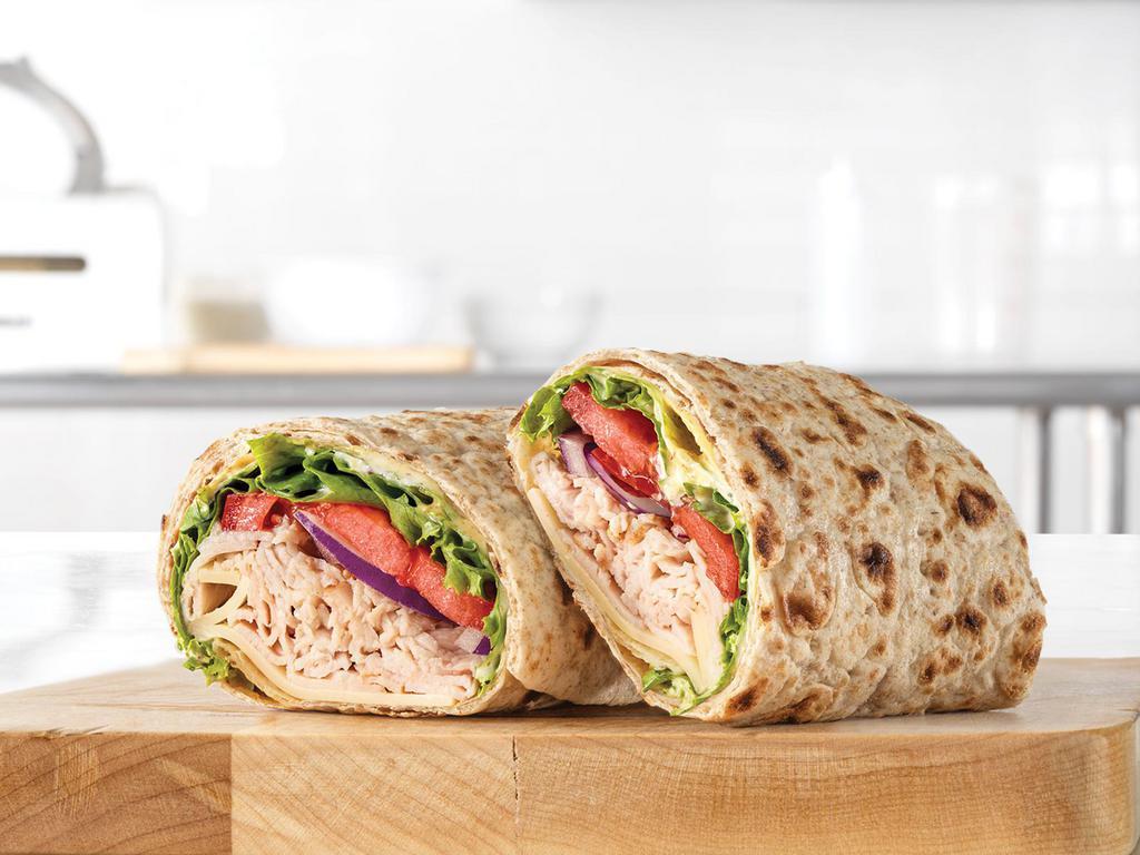 Market Fresh® Roast Turkey & Swiss Wrap · Oven-roasted turkey, ripe tomatoes, lettuce, thinly sliced red onions, Swiss Cheese, mayo and spicy brown honey mustard. Together they make the Roast Turkey & Swiss wrap, the wrap roast turkey was made to go on.