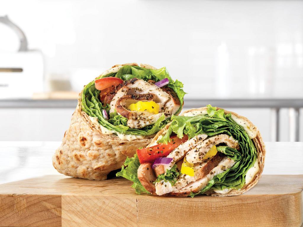 Market Fresh® Creamy Mediterranean Chicken Wrap · Slow-roasted chicken breast with cool and creamy tzatziki sauce, banana peppers, green leaf lettuce, tomato, and red onion in an artisan wheat wrap.