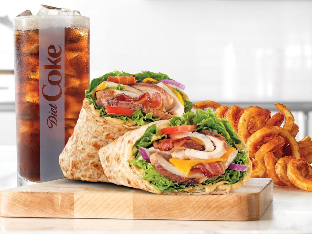Market Fresh® Chicken Club Wrap Small Meal · Slow roasted chicken breast with natural cheddar cheese, green leaf lettuce, red onion, honey mustard sauce, and tomato in an artisan wheat wrap. Served with a drink.