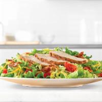 Roast Chicken Salad · Slow roasted chicken and diced pepper bacon on a bed of chopped fresh lettuce with diced tom...