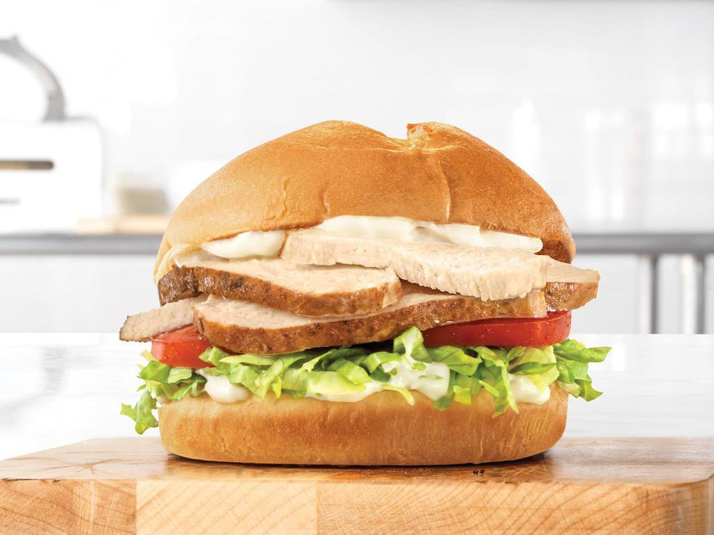 Roast Classic Chicken Sandwich · Slow roasted chicken with lettuce, tomato, and mayo on a toasted specialty bun.