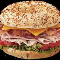 Turkey Club Sandwich · Turkey, bacon, American cheese, mayo, lettuce and tomato.