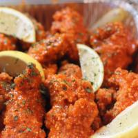 Garlic Lemon Pepper Wings · Frank's Red Hot, Tossed in Lemon Pepper & Minced Garlic; Served with Cajun Fries and Ranch
