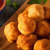 Fried Mac & Cheese Balls (4 pcs) · Mac and cheese balls fried. Served with honey mustard.