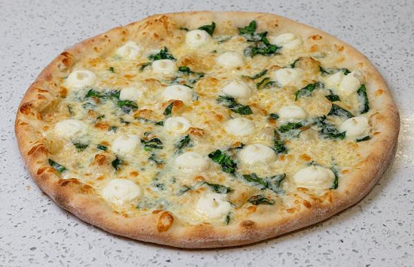 White Spinach Pizza · Garlic Sauce, Spinach, Mozzarella and Ricotta Cheese, Garlic butter.