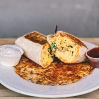 Breakfast Burrito · Scrambled eggs, grilled onions and green peppers with chipotle cream cheese and cheddar jack...