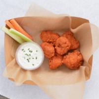 6 Crispy Boneless Wings · 6 Crispy boneless chicken wings tossed in 1 wing flavor and served with fresh carrot and cel...
