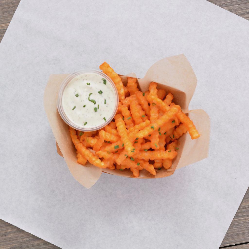 Buffalo Fries · Crispy crinkle cut fries tossed in buffalo sauce served with ranch or blue cheese dipping sauce.
