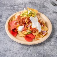 Nachos · Served with salsa and sour cream.