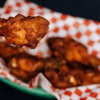 Chicken Wings Basket · 7 wings. Cooked wing of a chicken coated in sauce or seasoning.