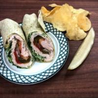 Boar's Head Turkey Breast Wrap · Served with romaine lettuce, tomato, onion, deli pickle and served with chips.