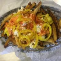 Mezze Fries · Hand cut fries topped with feta cheese, banana peppers and mezze sauce.
