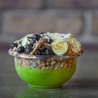 Caveman Bowl · Topped with granola, banana, blueberries, almond butter, coconut flakes, chia seeds and almo...
