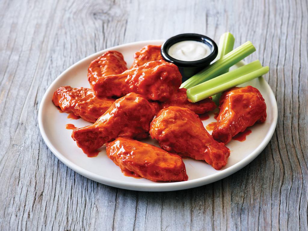 Double Crunch Bone-In Wings · Twice battered and fried, these crisp outside, tender inside wings are tossed in a choice of Classic Hot Buffalo sauce, Honey BBQ sauce, or Sweet Asian chile sauce. Served with Bleu cheese or ranch dressing.  Gluten Sensitive.