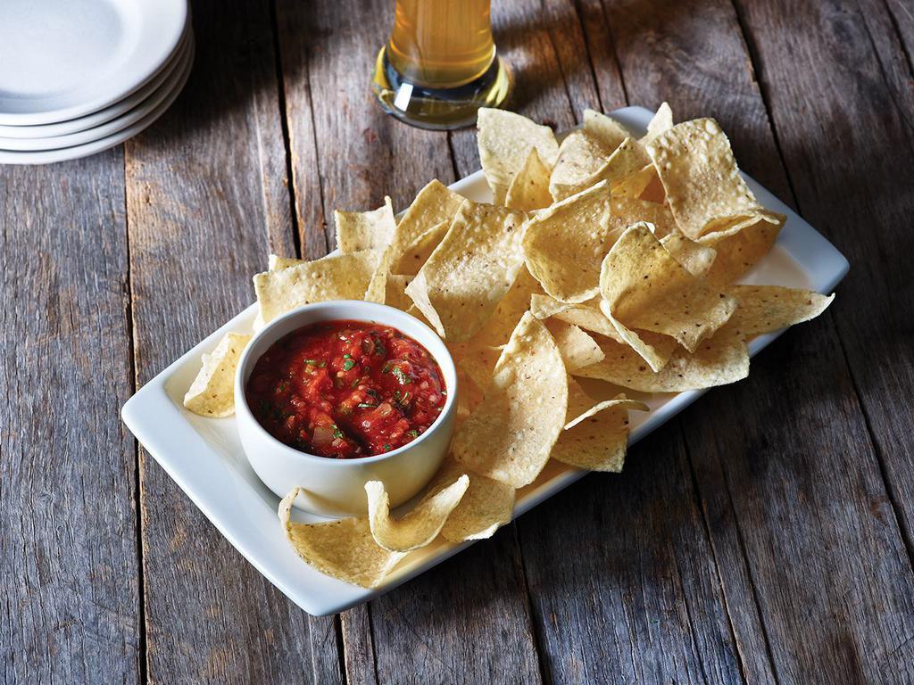 Chips and Salsa · Freshly made white corn tortilla chips and our chipotle lime salsa.