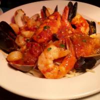 Linguini with mixed seafood · Served with scallops, clams, mussels, shrimp, calamari marinara or fra diavolo sauce.