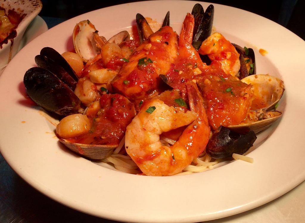 Linguini with mixed seafood · Served with scallops, clams, mussels, shrimp, calamari marinara or fra diavolo sauce.