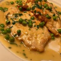 Chicken Francaise · Double breast of chicken lightly dipped in egg, green peas,sautéed in a white wine lemon but...