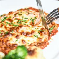 Chicken Parmigiana · breaded, sauteed in our marinara sauce topped with mozzarella cheese and baked to perfection